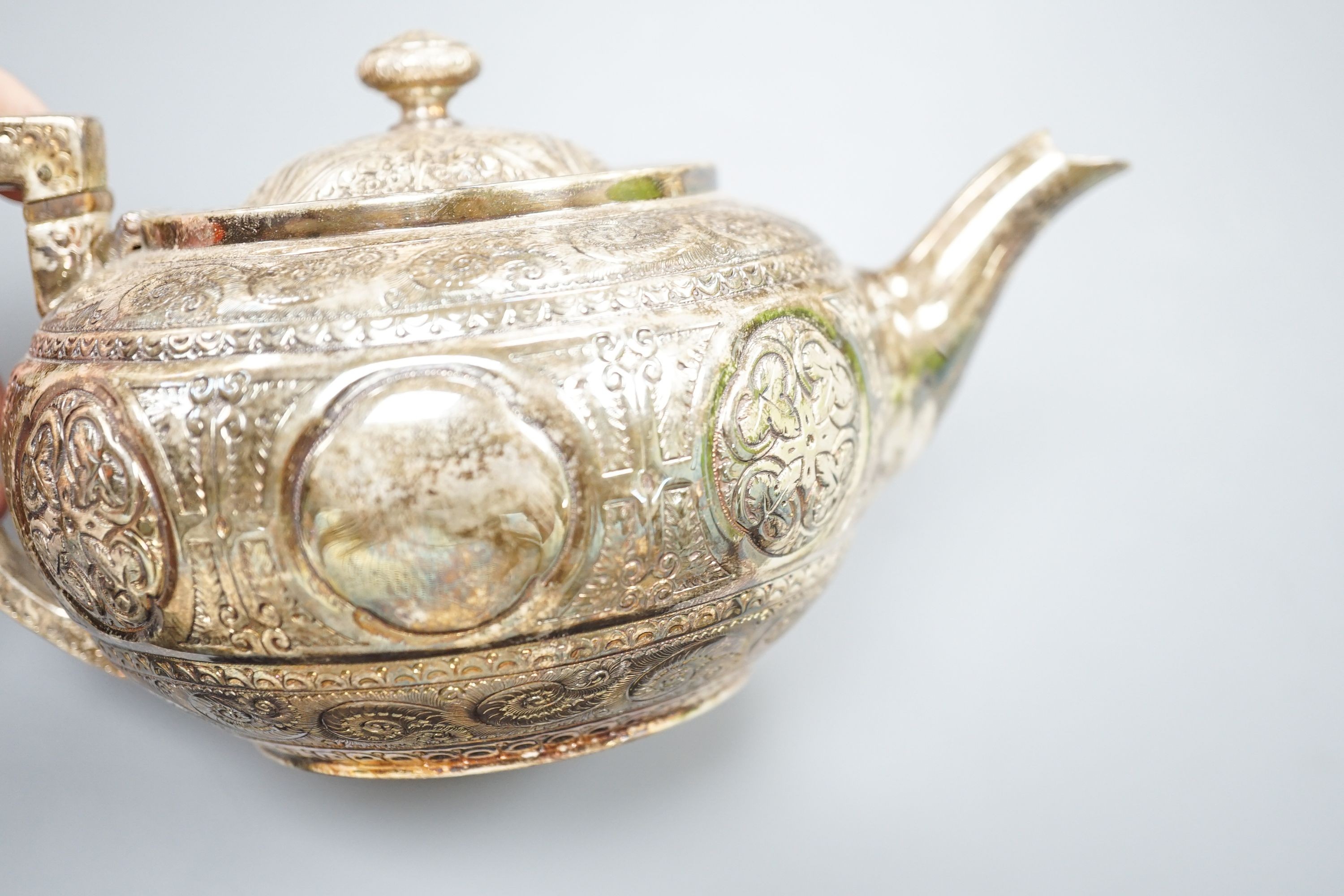 A WMF dish, Islamic white metal mounted photo album and a plated teapot and jug